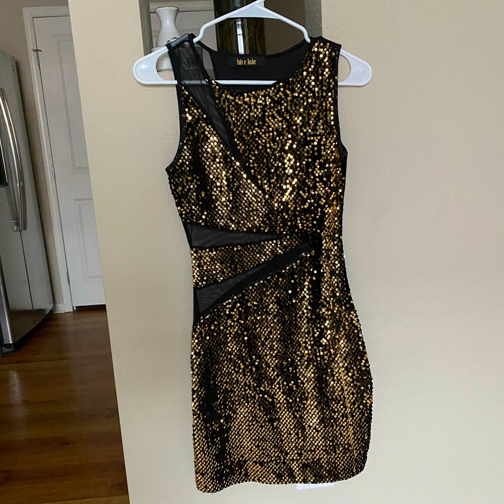 Gold sequin and black dress with mesh cutouts